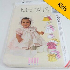 McCalls 9204 Sewing Clothing Pattern NEW BORN size Pinafore Dress, Bonnet, etc.